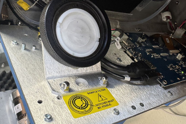 Calibration check being performed on air monitoring equipment